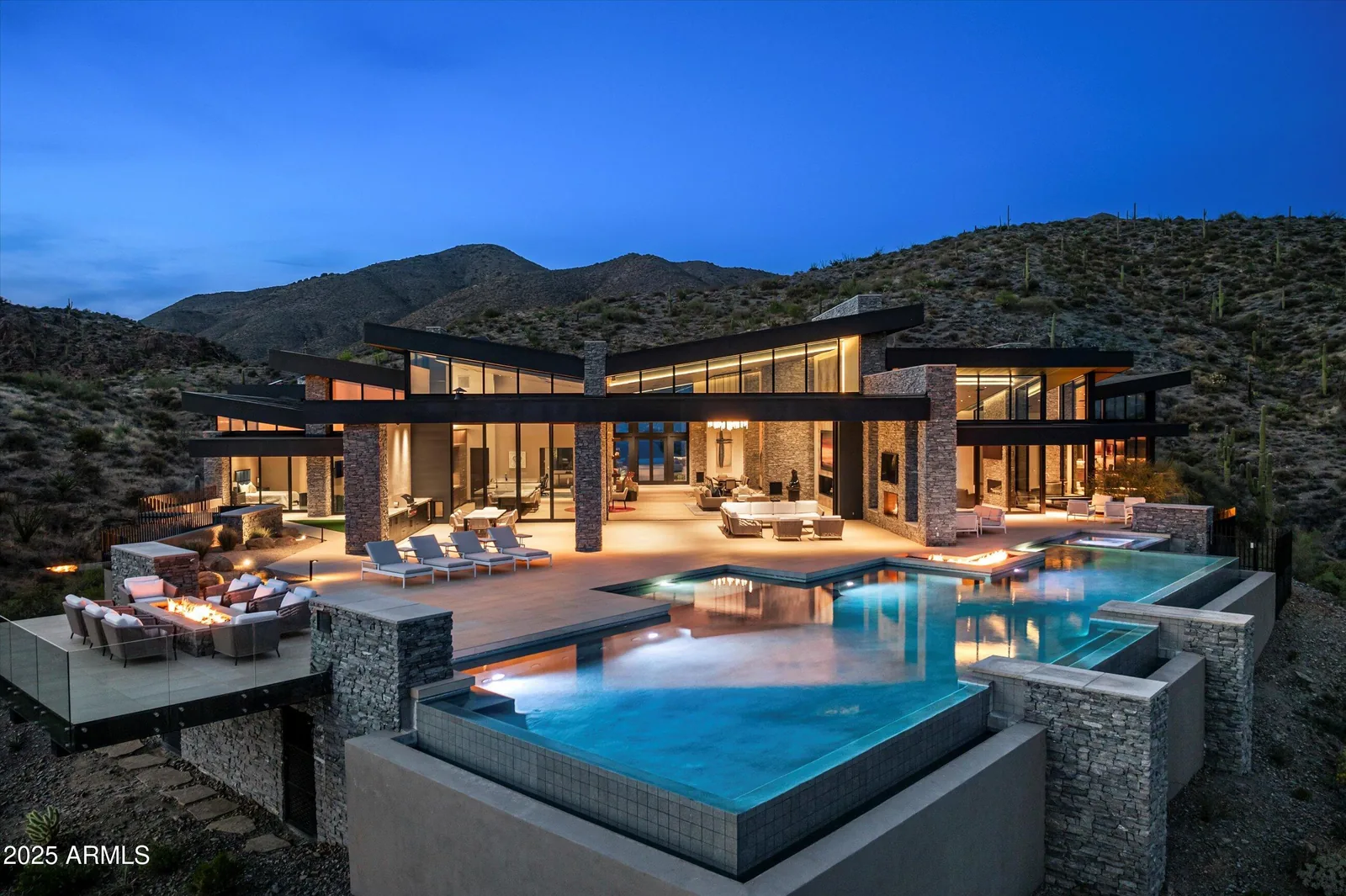 Desert residence and swimming pool at dusk